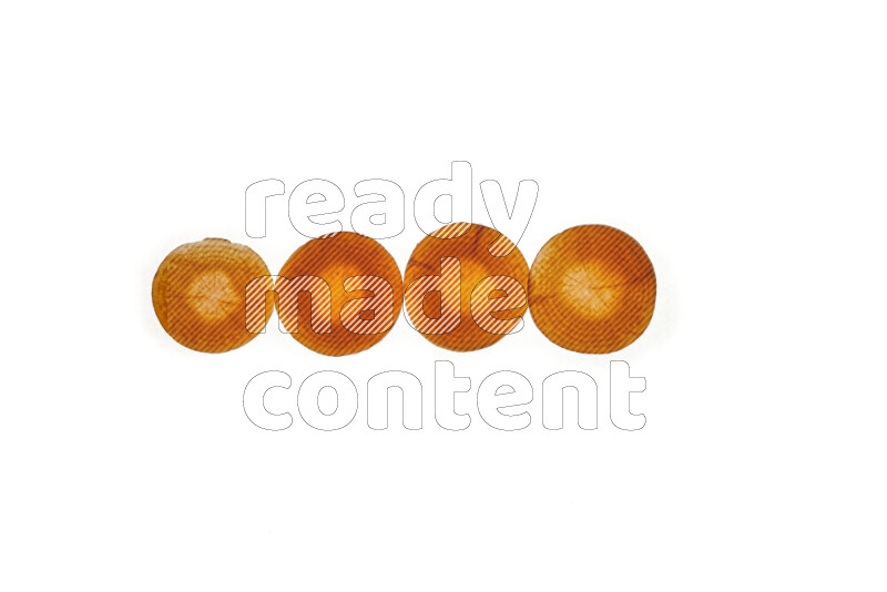 Carrots slices on illuminated white background