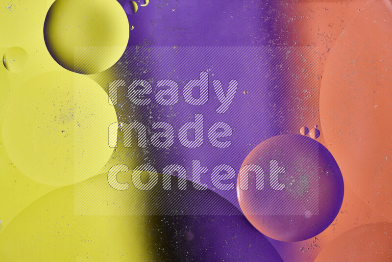 Close-ups of abstract oil bubbles on water surface in shades of yellow, orange and purple