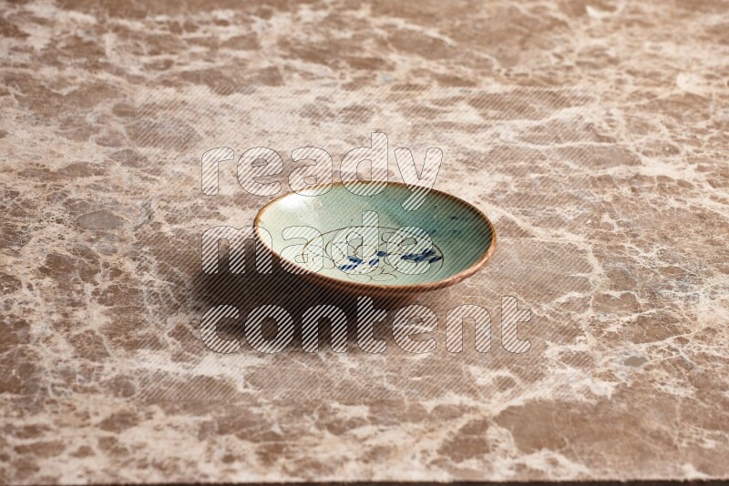 Decorative Pottery Plate on Beige Marble Flooring
