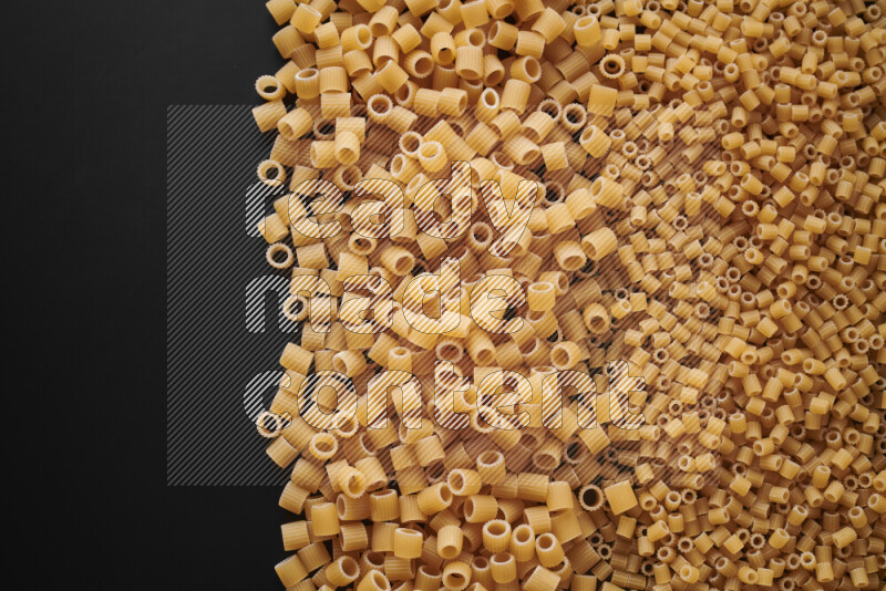 Different pasta types on black background