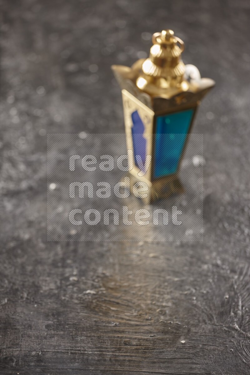 An out of focus lantern on textured black background