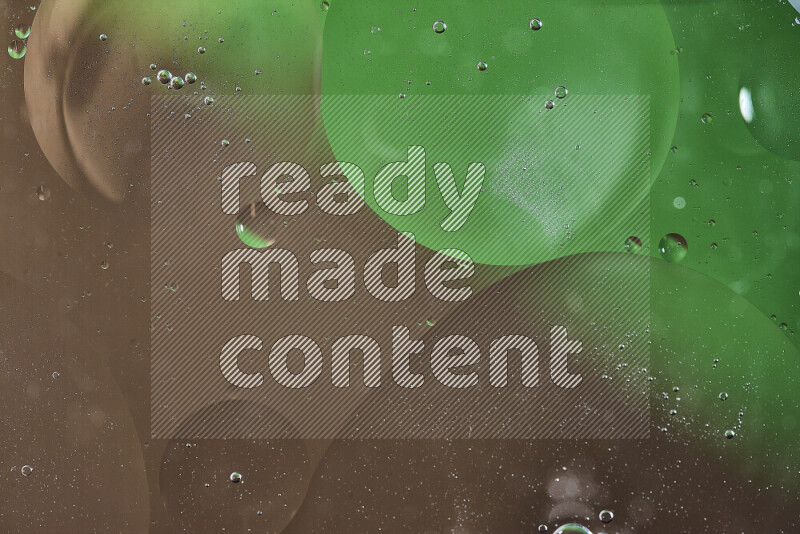Close-ups of abstract oil bubbles on water surface in shades of green and brown