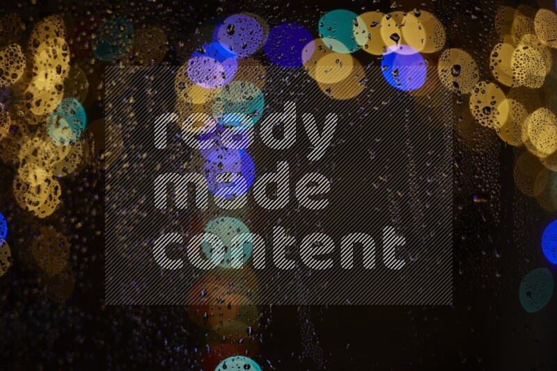 Bokeh light in multicolor with water drops