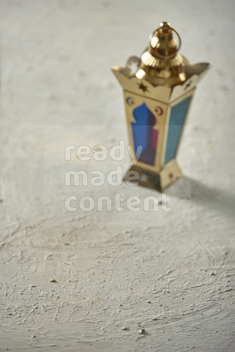 A lantern placed on a textured white background