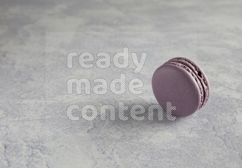 45º Shot of Purple Blueberry macaron on white  marble background