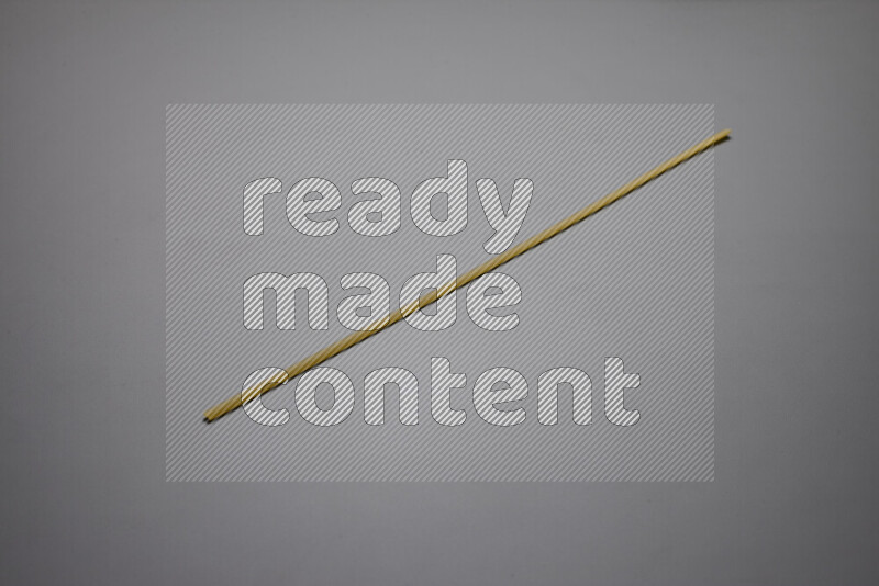 Linguini pasta on grey background