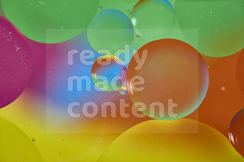 Close-ups of abstract oil bubbles on water surface in multicolors