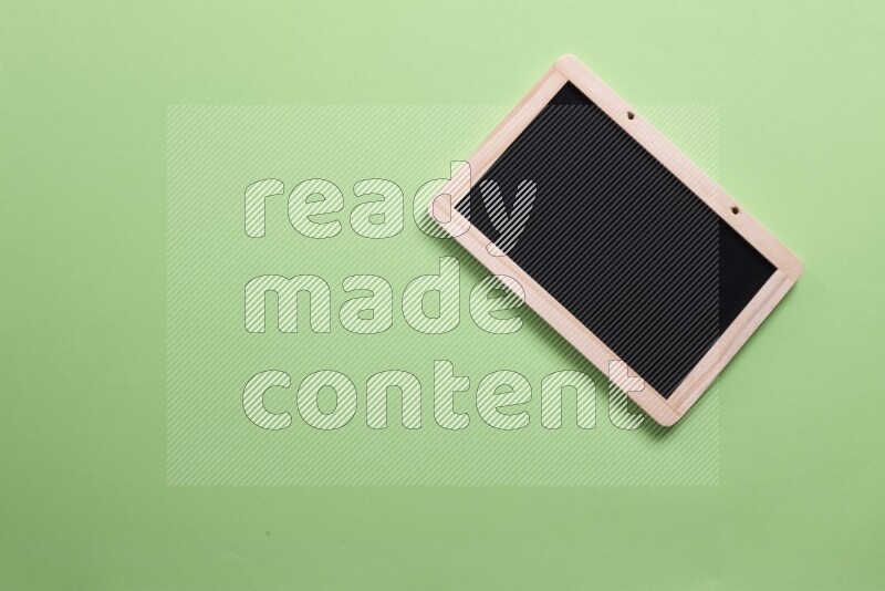 A blackboard on green background