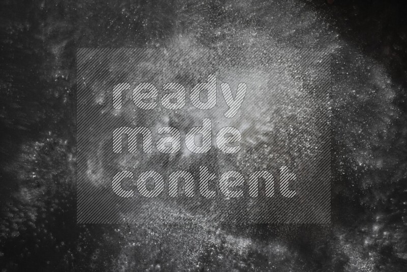 White powder explosion on black background