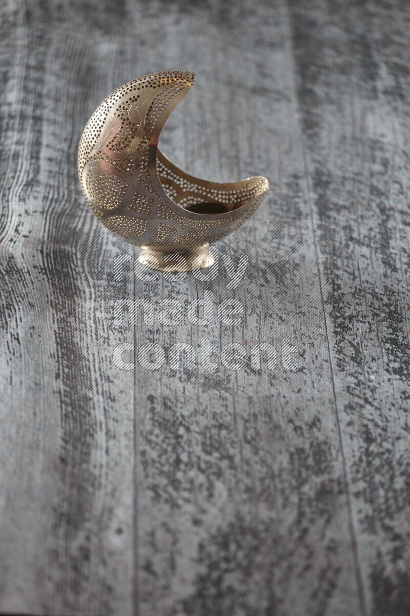 A lantern placed on a wooden background
