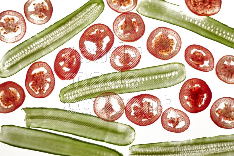 Mixed vegetables slices on illuminated white background