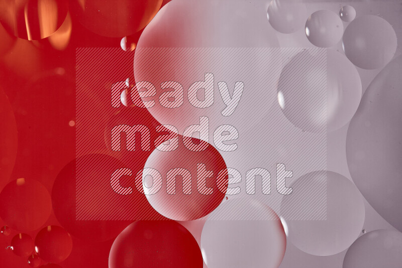 Close-ups of abstract oil bubbles on water surface in shades of white and red