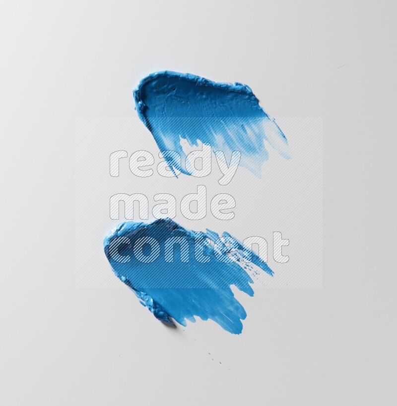 Blue painting knife strokes on white background