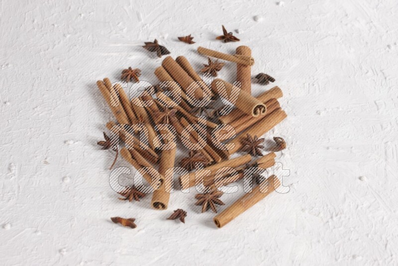 cinnamon sticks with star anise on white background