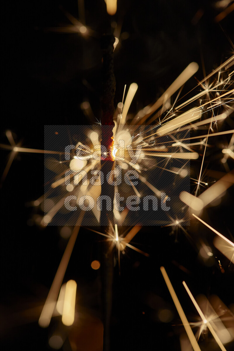 A close-up image of sparkler candle isolated on black background