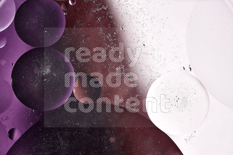 Close-ups of abstract oil bubbles on water surface in shades of white, orange and purple