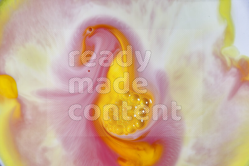 A close-up of abstract swirling patterns in orange, red and white