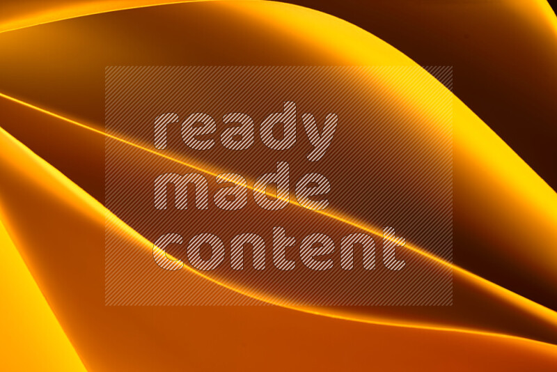 This image showcases an abstract paper art composition with paper curves in yellow, red and brown gradients created by colored light