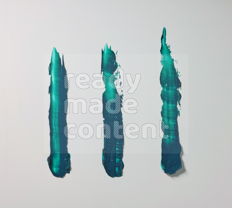 Turquoise painting knife strokes on white background