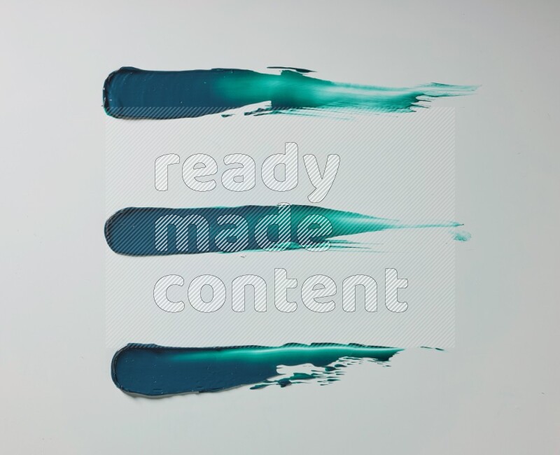 Turquoise painting knife strokes on white background