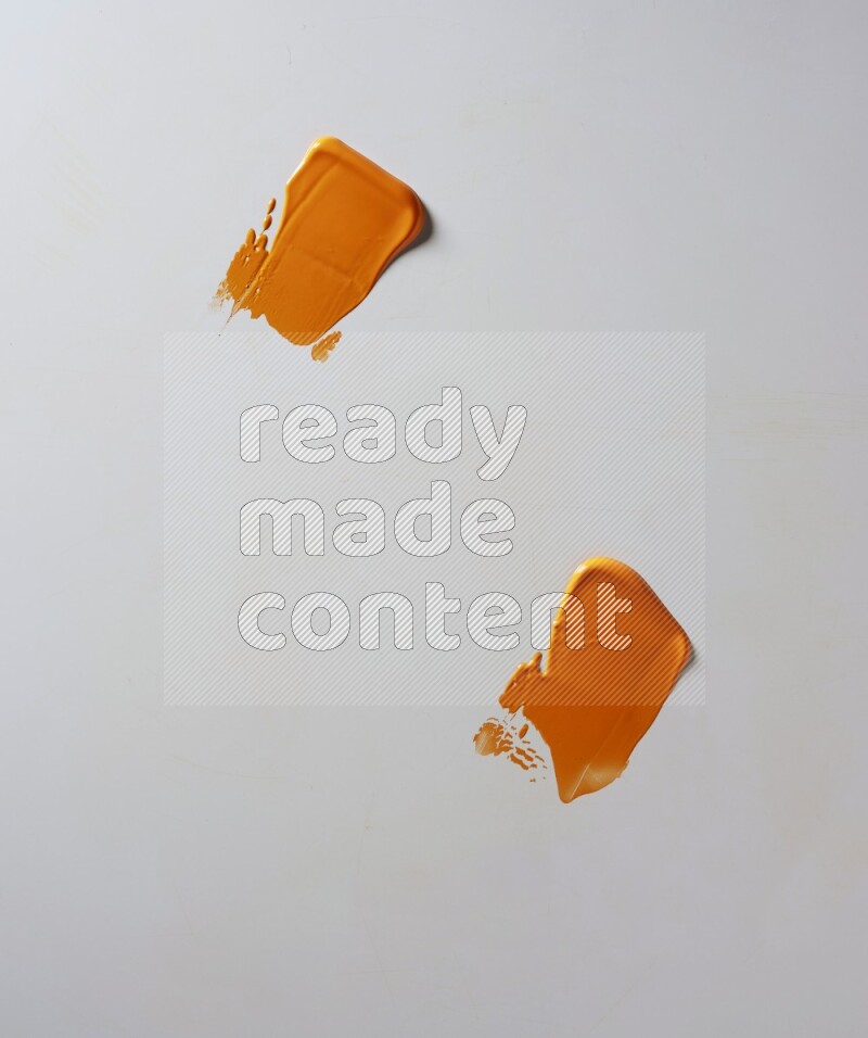 Orange painting knife strokes on white background