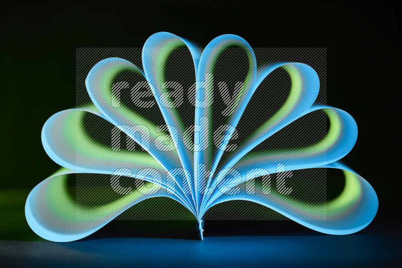 An abstract art piece displaying smooth curves in blue and green gradients created by colored light