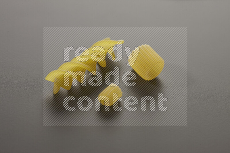 Different pasta types on grey background
