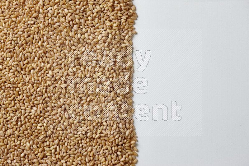 Hulled wheat on white background