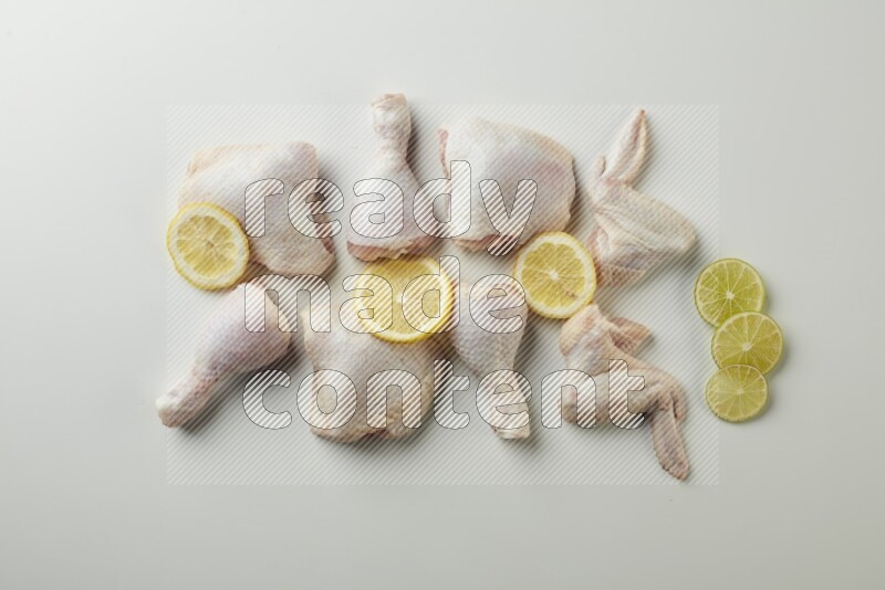 Mixed fresh chicken pieces direct on a white background