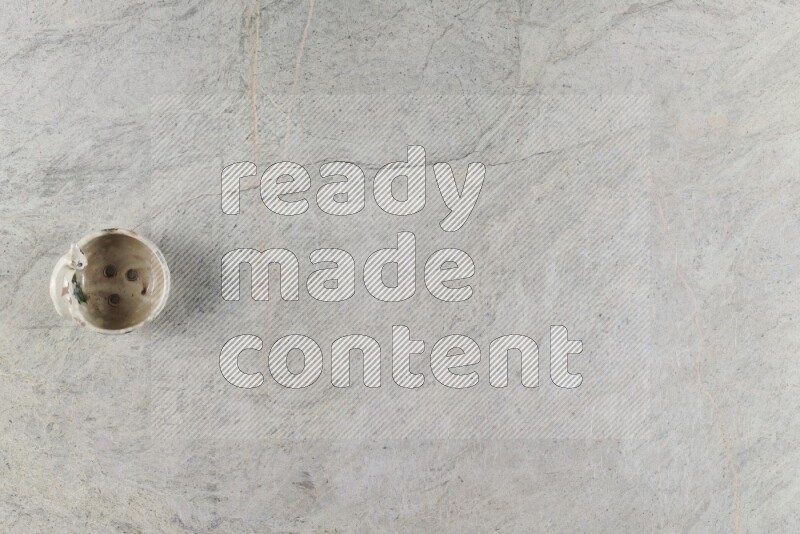 A pottery soap holder on grey marble background