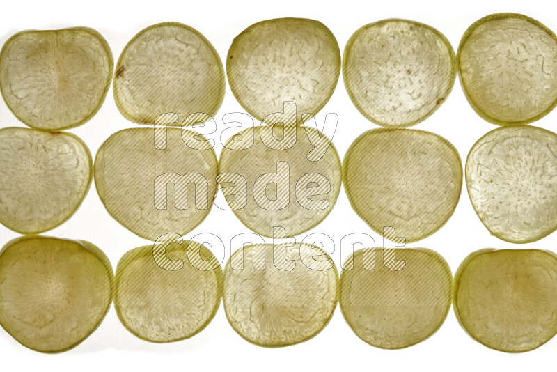 Plum slices on illuminated white background