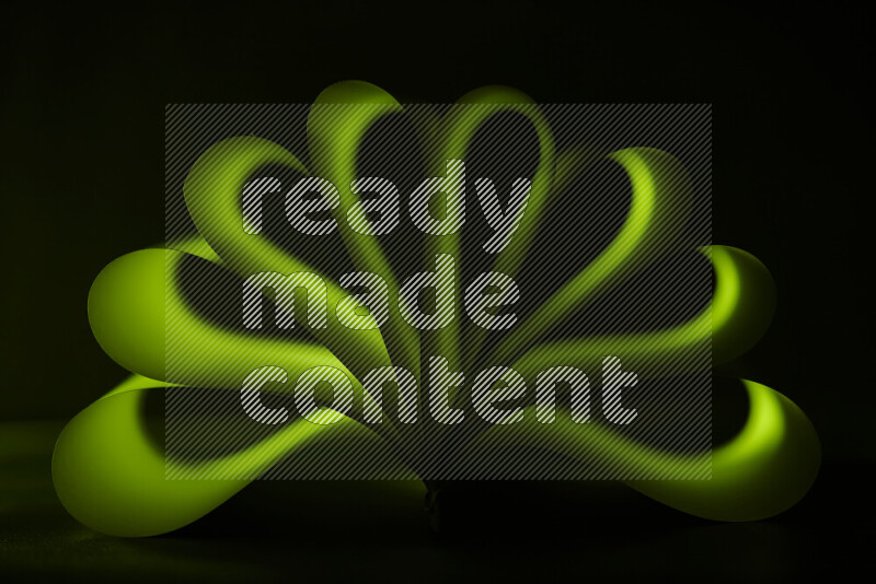 An abstract art piece displaying smooth curves in green gradients created by colored light