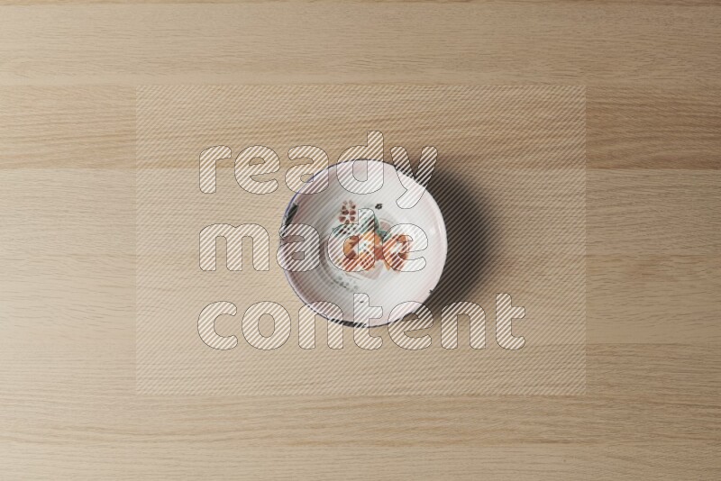 A vintage metal plate on light wooden background