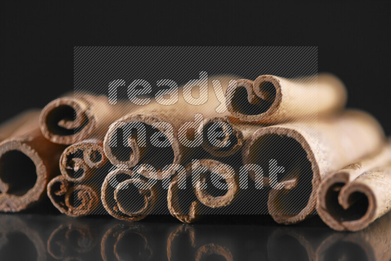 Cinnamon sticks on black background