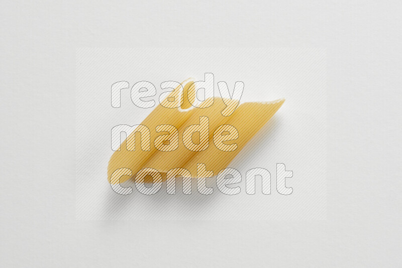 Penne pasta on white background