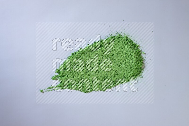 Green powder strokes on white background