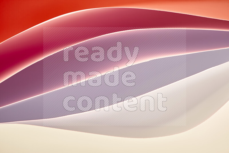 This image showcases an abstract paper art composition with paper curves in white and different warm gradients created by colored light