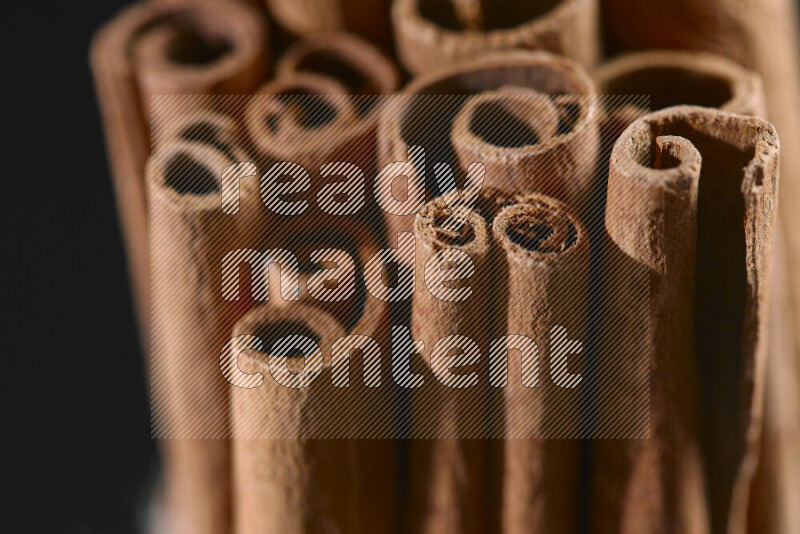 Cinnamon sticks on black background