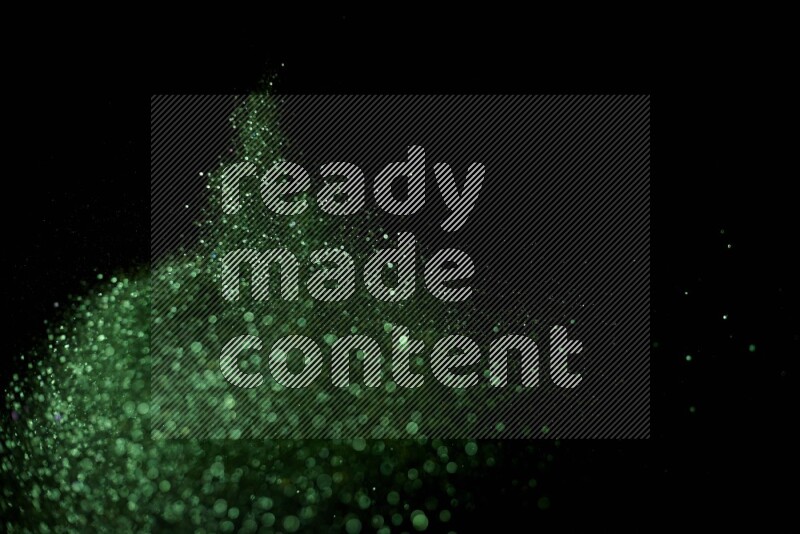 Green glitter powder isolated on black background