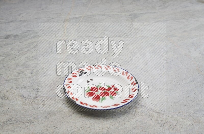A vintage metal plate on grey marble background