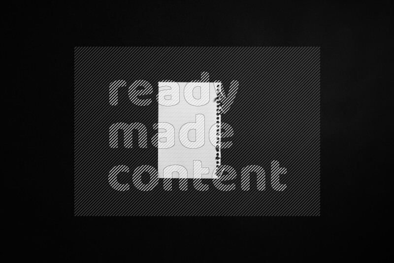 Notebook sheet on black background