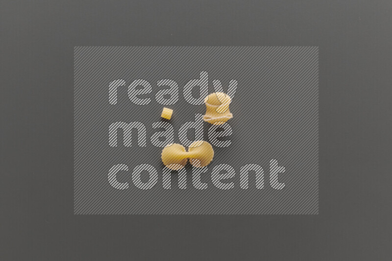 Different pasta types on grey background