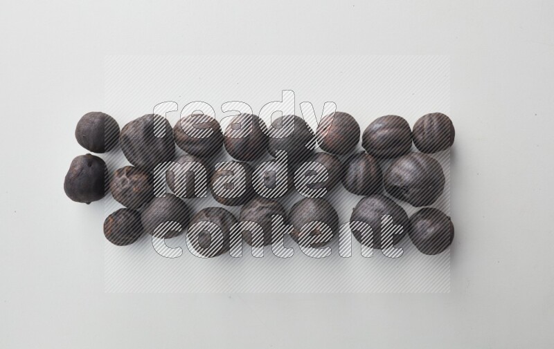 Top-view shot of dried lime (loomi) on white background