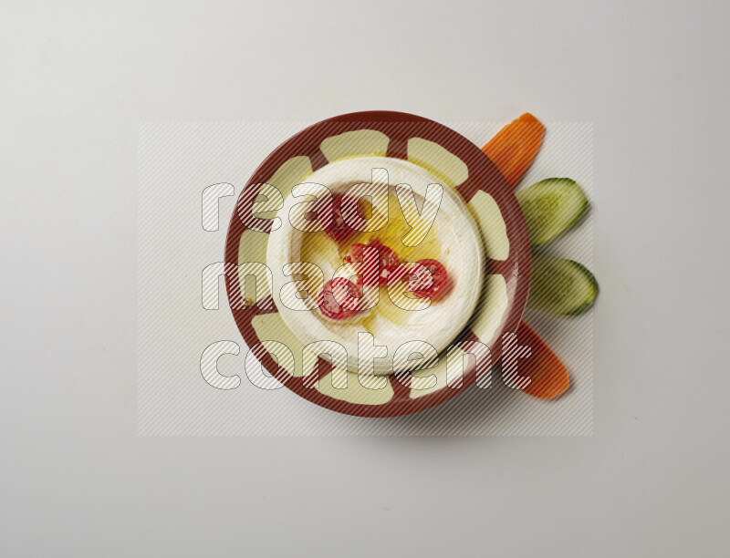 Lebnah garnished with Cherry tomato in a traditional plate on a white background
