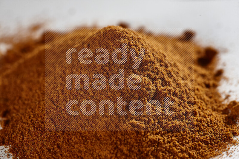 A bunch of ground paprika powder on white background