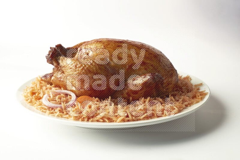 red basmati Rice with  whole roasted chicken on a white rounded plate  direct  on white background
