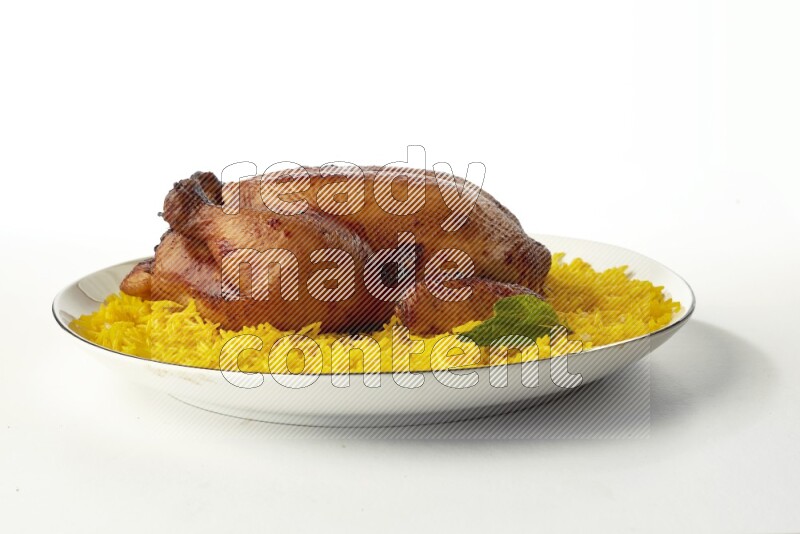 yellow  basmati Rice with kabsa chicken pieces on a white plate with a silver rim direct on white background