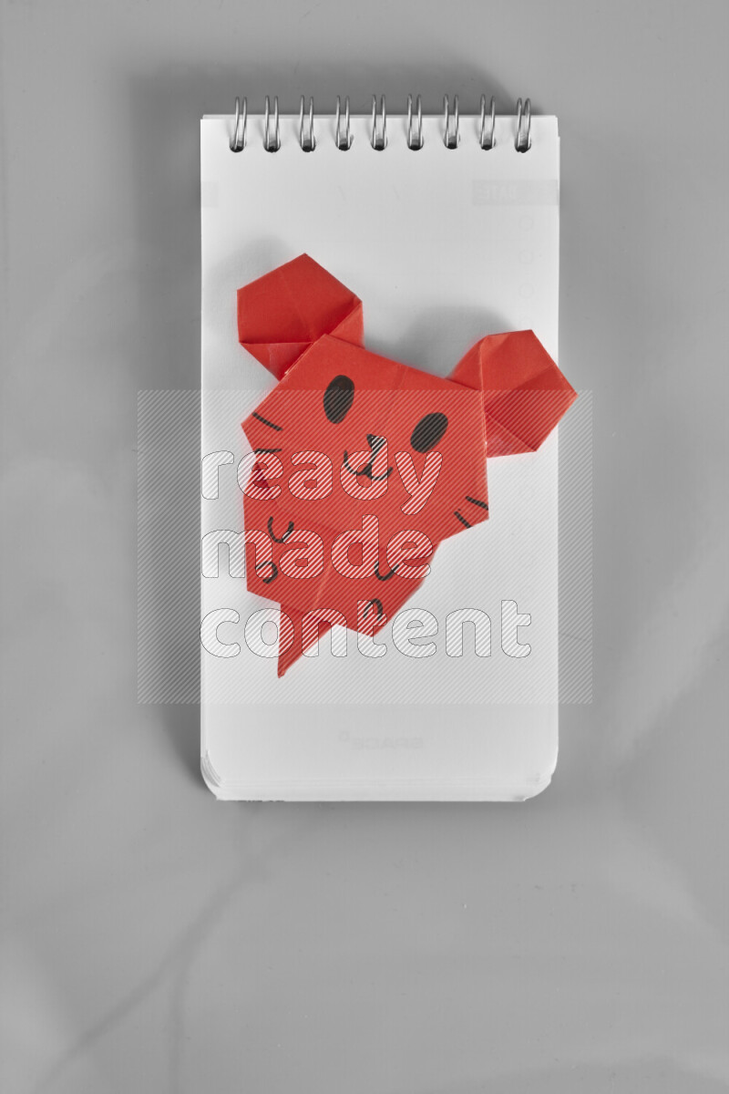 Origami animals on grey background