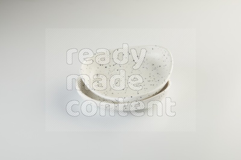 white plate with black dots on white background