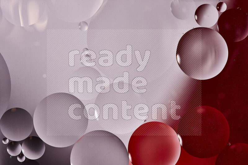Close-ups of abstract oil bubbles on water surface in shades of white and red